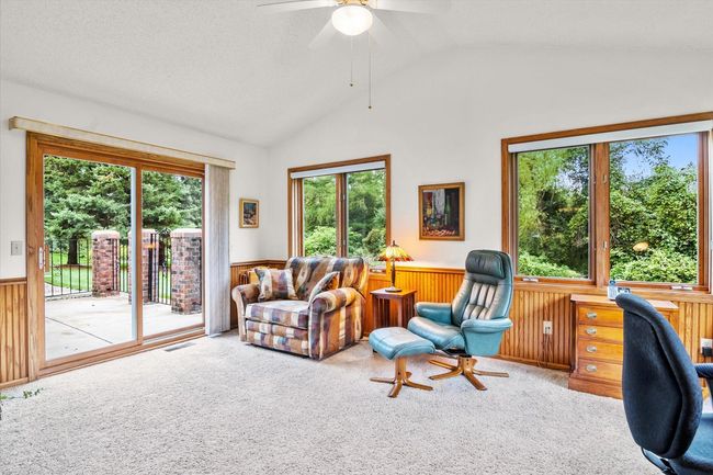 Sunroom walks out to the patio. | Image 7