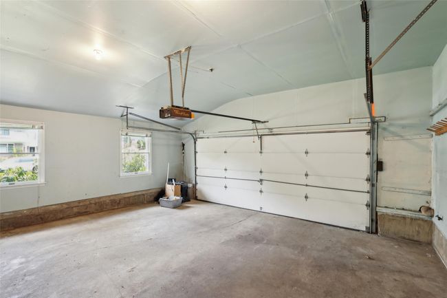 Garage featuring a garage door opener | Image 27