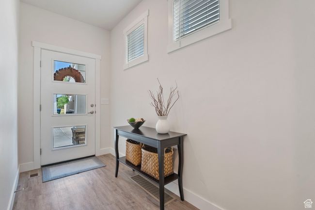 Foyer with wood finished floors and plenty of natural light | Image 11