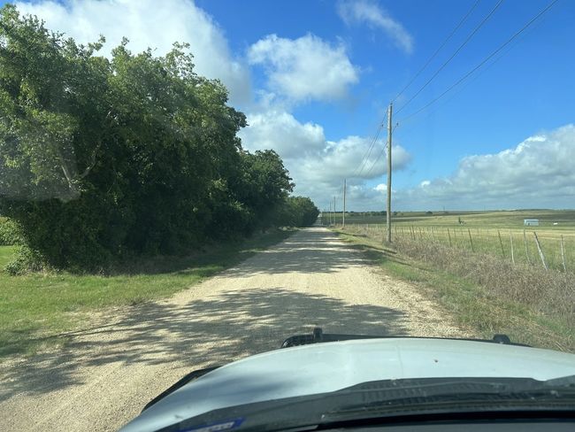 View of dirt / gravel road with a view of countryside | Image 13