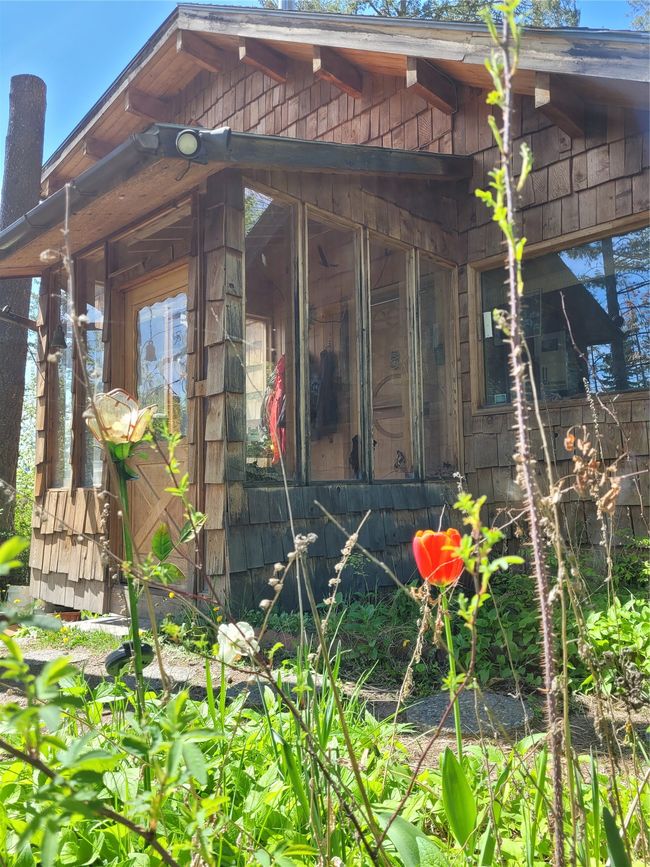 View of side of home with a sunroom | Image 96