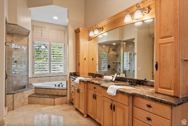 Master Bathroom featuring double vanity, a stall shower, and a bath | Image 40