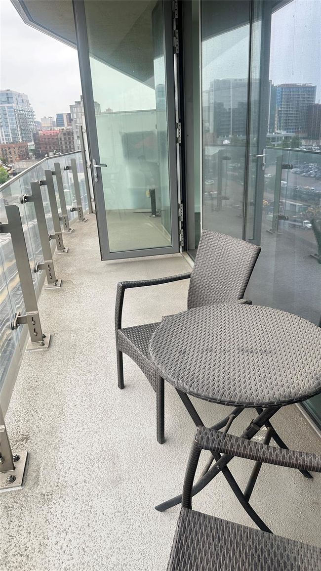 Balcony featuring a view of city | Image 9