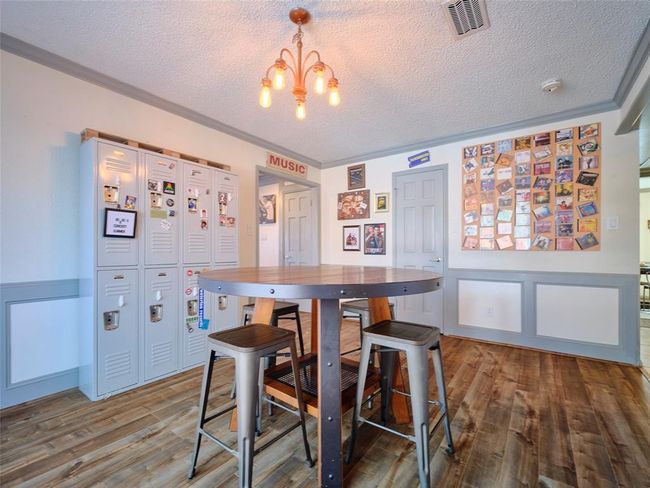Located just off the kitchen, this room creates a seamless transition from the front to the back of the home. | Image 8