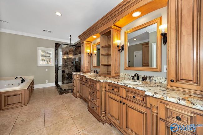 Tile flooring, 9'ceiling, double vanities, walk in shower, whirlpool, recessed lighting, crown molding | Image 26