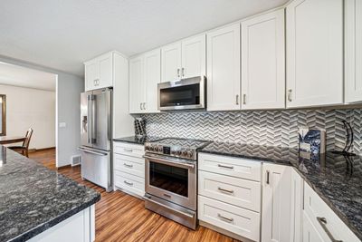 The new cabinetry is both beautiful and functional with plentiful drawer storage options! | Image 3