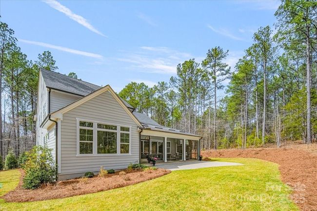 A private backyard. An HOA approved landscaping plan will convey to the new owners courtesy of the seller. | Image 30