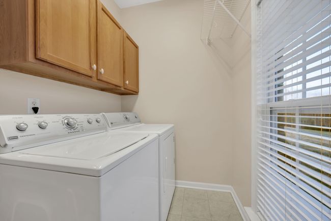 LARGE Laundry w/ Custom Cabinetry + Natural Light | Image 34
