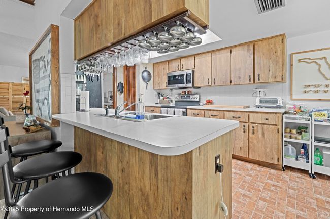 8268 Garrison St, House other with 3 bedrooms, 3 bathrooms and null parking in Spring Hill FL | Image 27