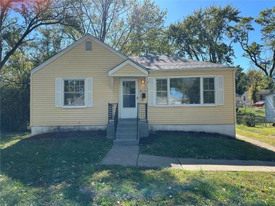 Bungalow-style home with a front lawn | Image 1