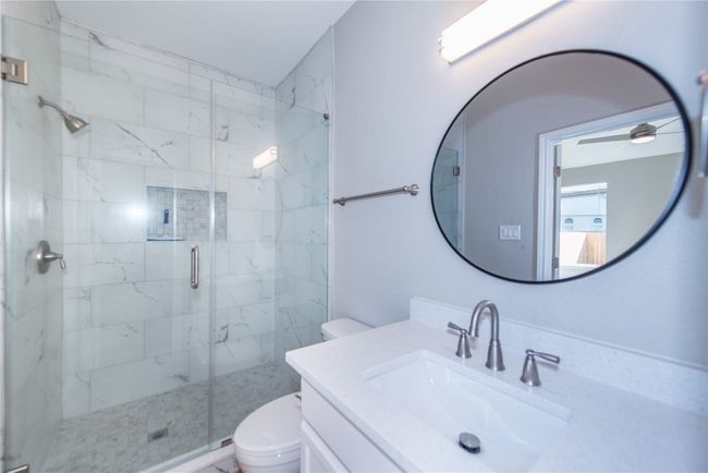 Amazing walk in shower, all new tile, quartz countertops, walk in closet | Image 14