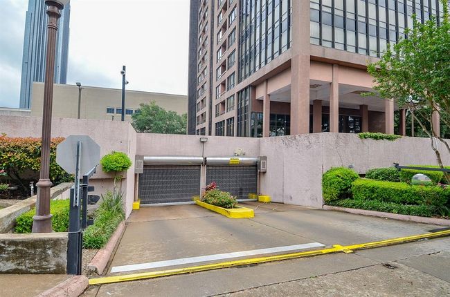 There is an underground garage with two assigned parking spaces. | Image 31