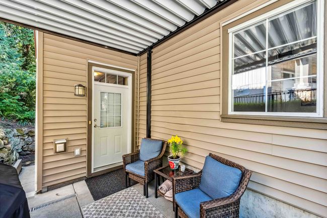 View of exterior entry with a patio area | Image 4