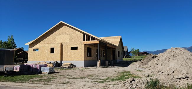 Rear view of house with a mountain view | Image 25