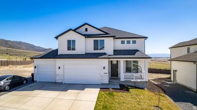 Front facade featuring a garage and a mountain view | Image 2