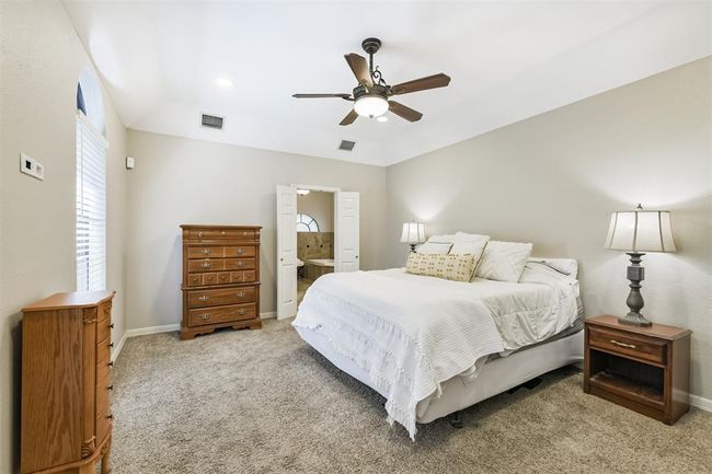 Experience the elegance of high ceilings and soothing neutral tones throughout this inviting home. | Image 24