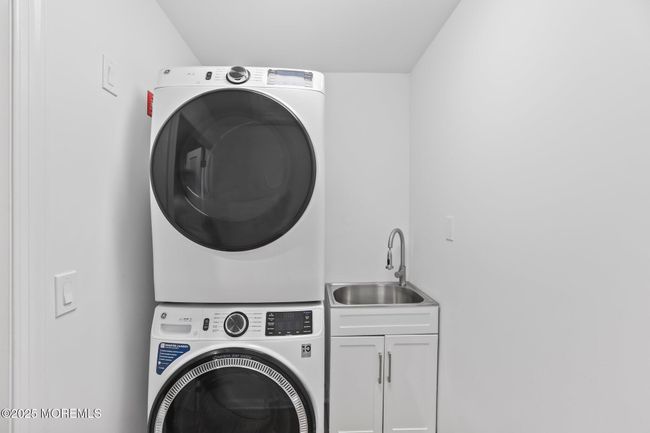 laundry room, stacked washer and dryer, sink | Image 37