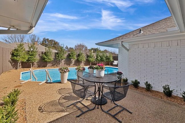 View of pool with a fenced in pool, a fenced backyard, and a patio area | Image 33