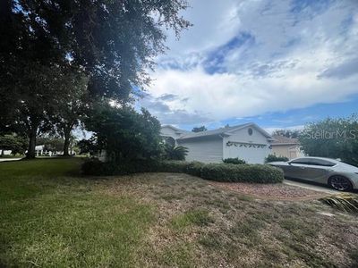 1009 Forest Breeze Path, House other with 3 bedrooms, 2 bathrooms and null parking in Leesburg FL | Image 2