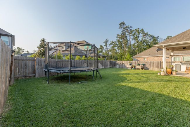 An expansive backyard designed for both fun and relaxation—the ideal space for outdoor activities, gatherings, or simply unwinding in your private retreat. | Image 50
