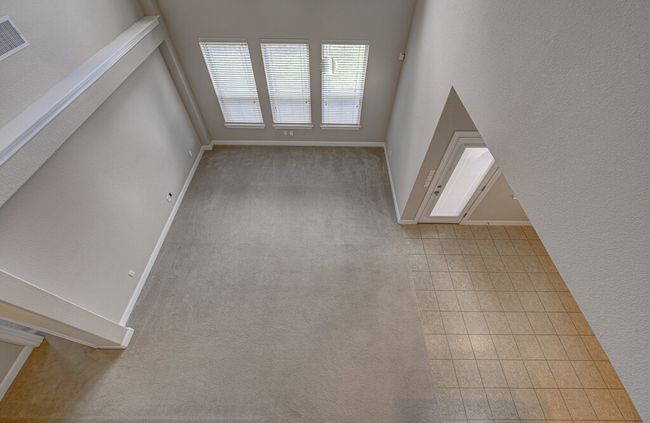 Unfurnished living room featuring baseboards and carpet floors | Image 26
