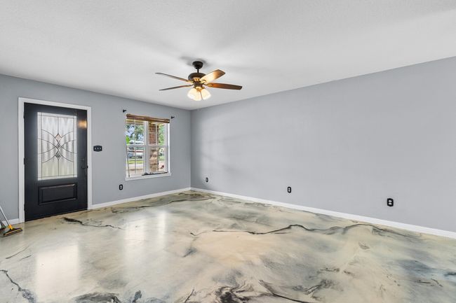 Entryway with concrete floors and a ceiling fan | Image 18
