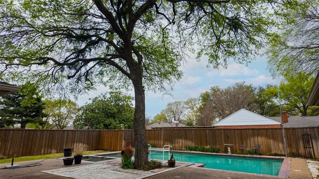 View of pool with a fenced backyard, a fenced in pool, and a patio | Image 7