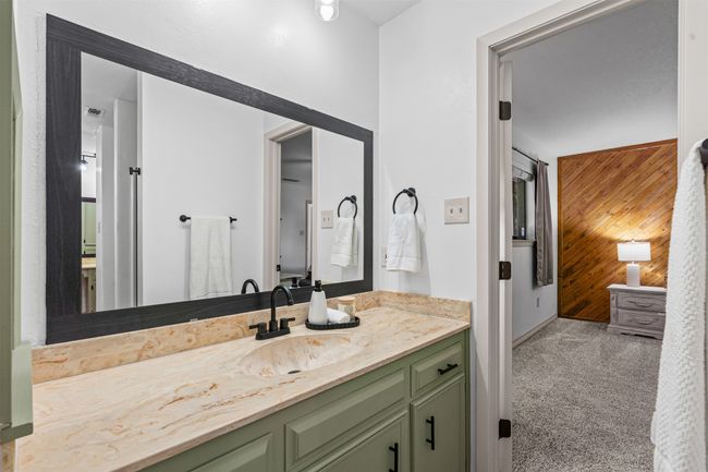 Bathroom with wood walls and vanity | Image 20