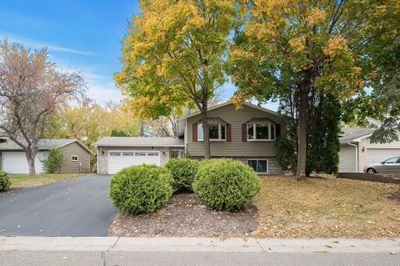 Enjoy a maintenance-free exterior with a newer roof and a long driveway that provides ample extra parking—ideal for hosting and convenience. | Image 3