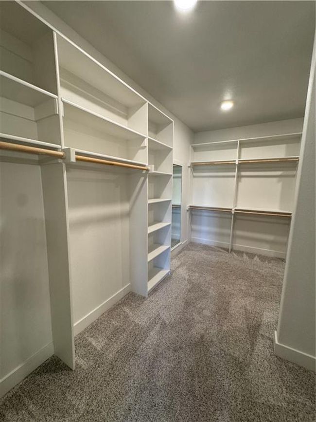 Walk in closet with carpet flooring | Image 38