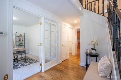 To the left of the entrance is a refreshed den or office, complete with French doors for a peaceful, private space. | Image 3