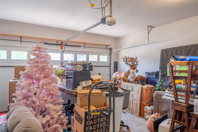 Garage featuring a garage door opener | Image 53
