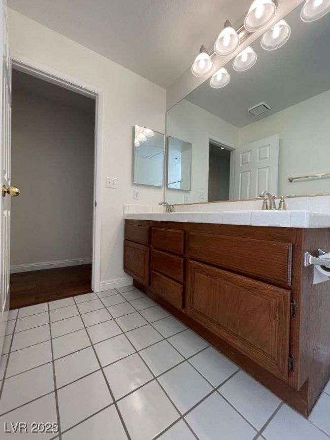 Bathroom featuring double vanity and tile patterned floors | Image 18