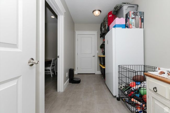 Washroom with baseboards and light tile patterned floors | Image 63