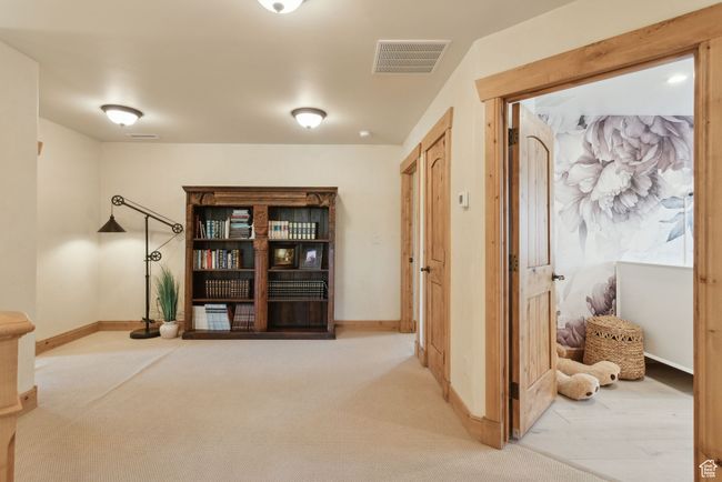 Hall featuring carpet flooring and baseboards | Image 23