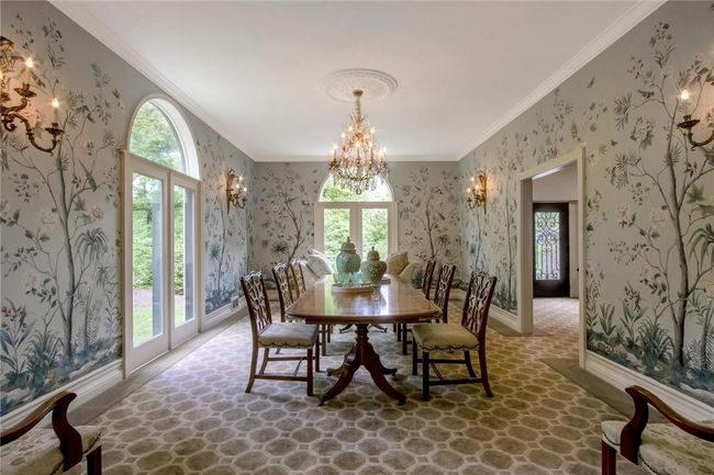 Dining area with ornamental molding and an inviting chandelier | Image 14