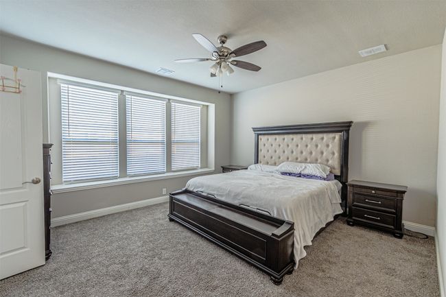 Carpeted bedroom featuring baseboards and ceiling fan | Image 17