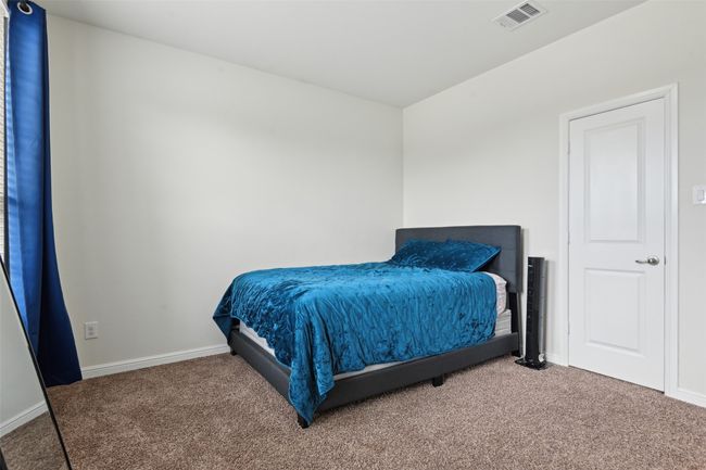 Bedroom featuring carpet flooring and baseboards | Image 19