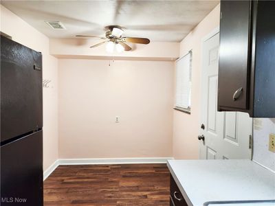 Clothes washing area with ceiling fan and dark hardwood / wood-style floors | Image 3