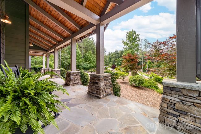 Flagstone front porch greats you as you enter. | Image 26