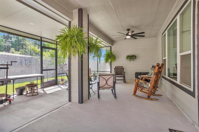 Relax and unwind outdoors under a spacious covered porch—perfect for enjoying a morning coffee, evening breeze, or weekend barbecues. | Image 35
