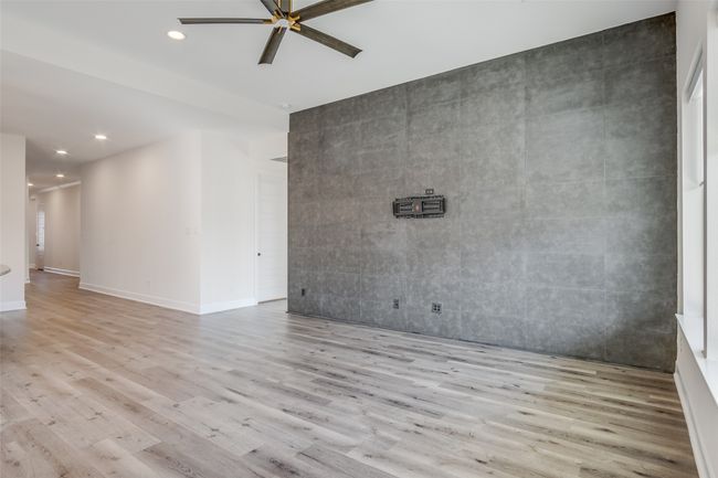 Spare room featuring a ceiling fan, wood finished floors, and recessed lighting | Image 16