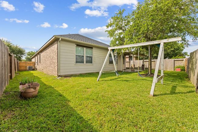 Backyard comes with covered patio area and a Tuff shed for additional storage | Image 40