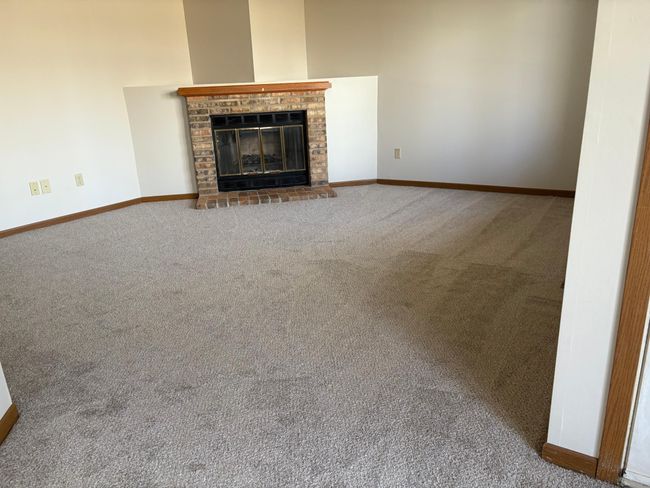 Inviting living area with wood burning fireplace | Image 5