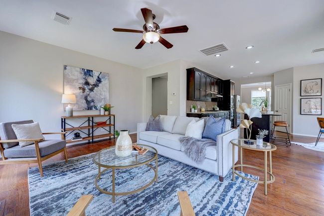Living room featuring ceiling fan, wood finished floors, baseboards, and recessed lighting | Image 14