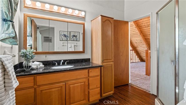 Bathroom adjacent to loft and primary bedroom upstairs - ample closet space and a corner step-in shower & new toilet. | Image 17