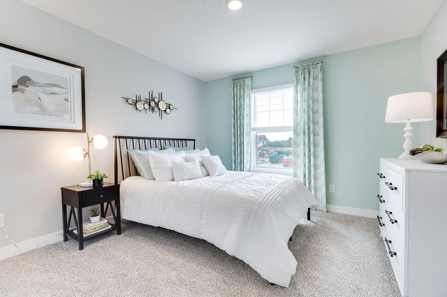 One of three secondary bedrooms upstairs with plenty of natural light in each. *Pictures are of a model home, actual colors and finishes may vary. | Image 25