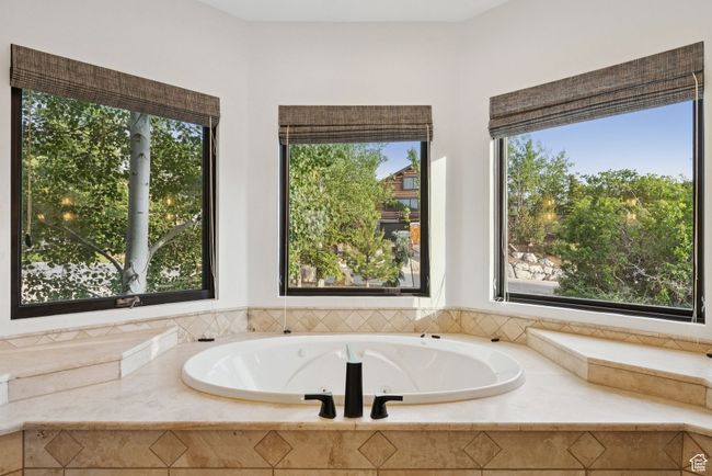 Bathroom featuring a whirlpool tub | Image 38