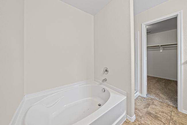 Full bath with a bath and a walk in closet | Image 24
