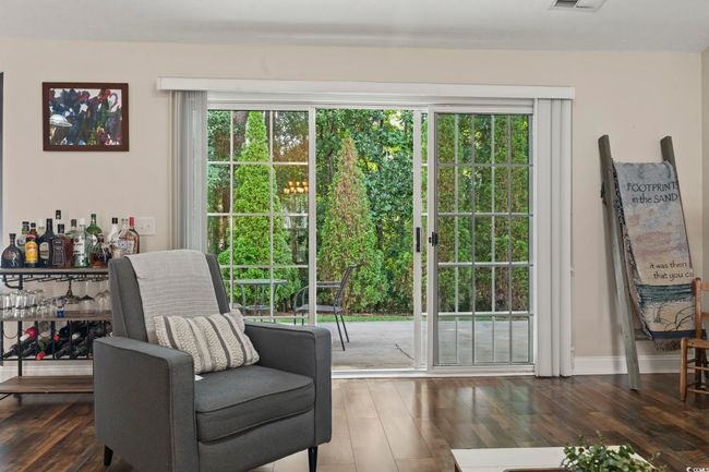 Sitting room with hardwood / wood-style floors and plenty of natural light | Image 10